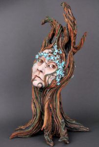 ceramic sculpture of a tree lady in deep thought